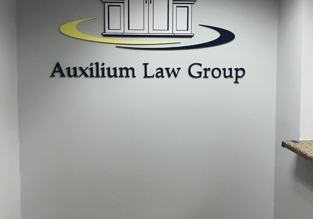 Removal and Re-installation of Auxilium Law Group’s Lobby Sign