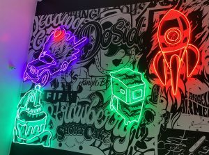 Read more about the article Rocket, Shopping Cart and Ice Cream Neon Wall Signs for Jungle Boy in Los Angeles