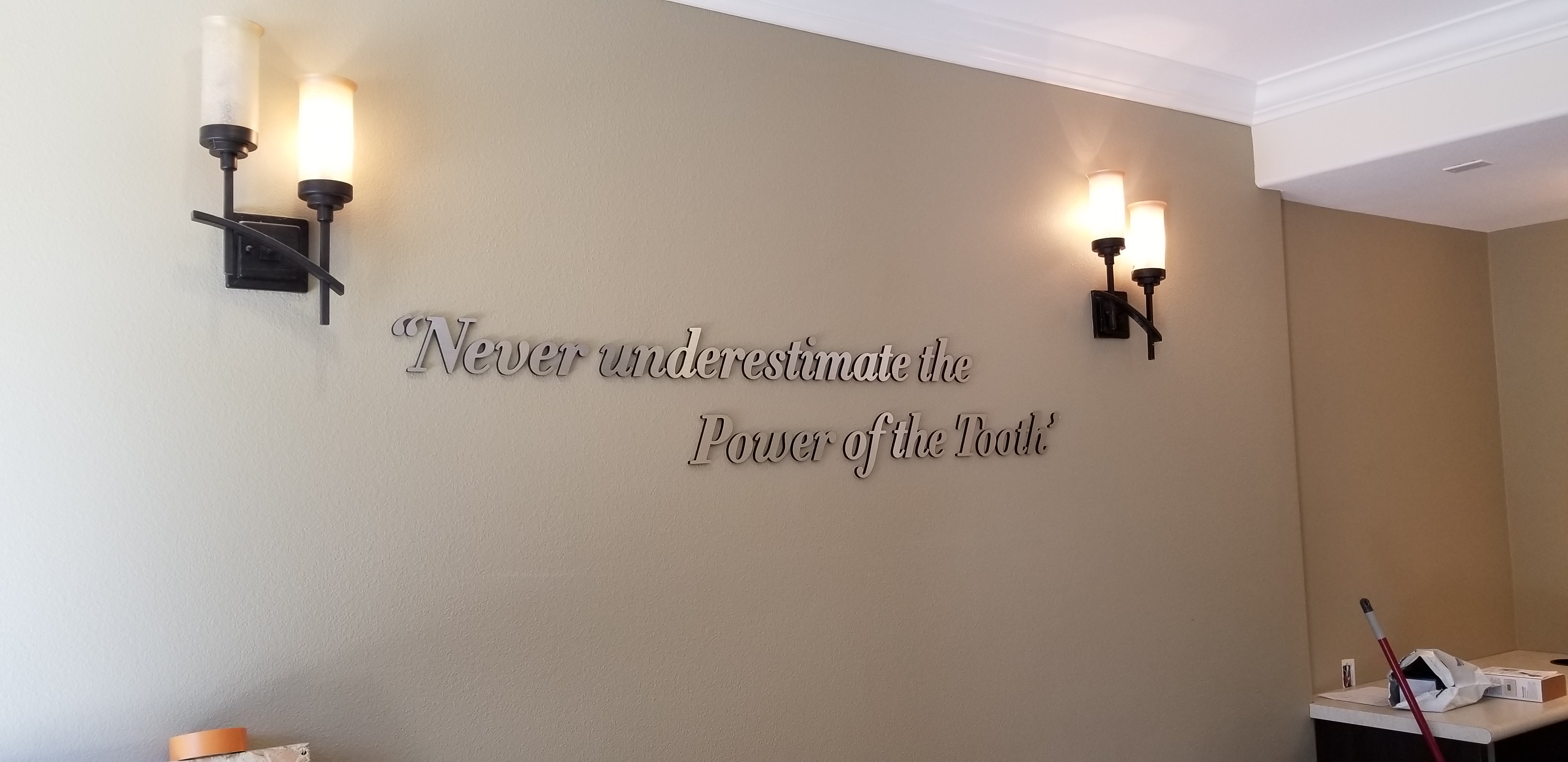 Inspiring words can decorate a lobby, brighten days and also complimenting the centerpiece. Like this dentist clinic lobby sign for Glendora Oral Surgery.