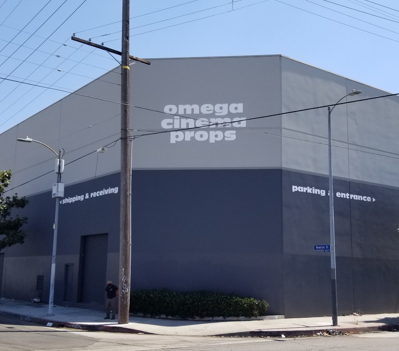 You are currently viewing Hand-Painted Business Sign for Omega Cinema Props in Los Angeles