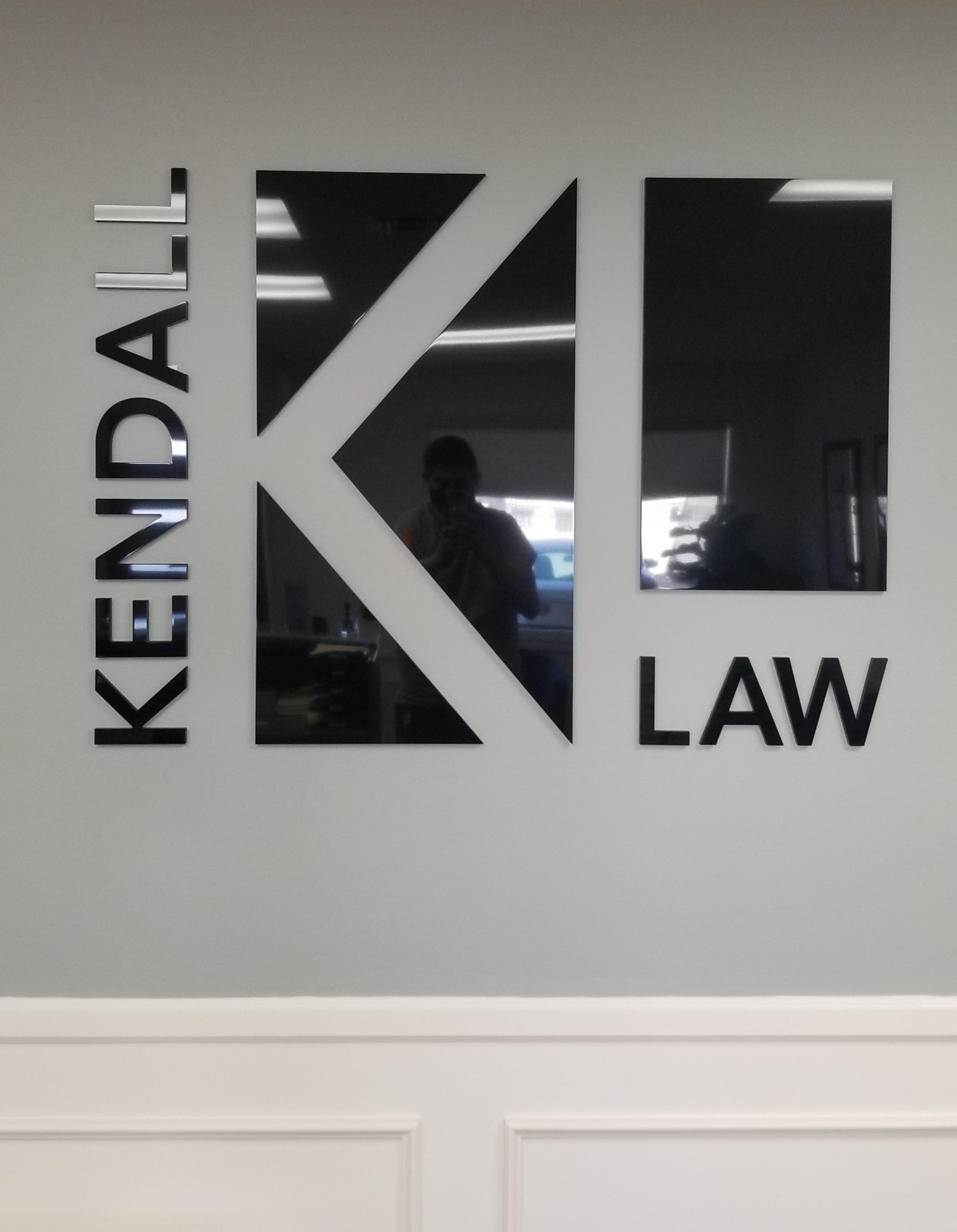 This is the law office lobby sign for Kendall Law. With this, the Torrance firm has a prominent centerpiece in their reception area.