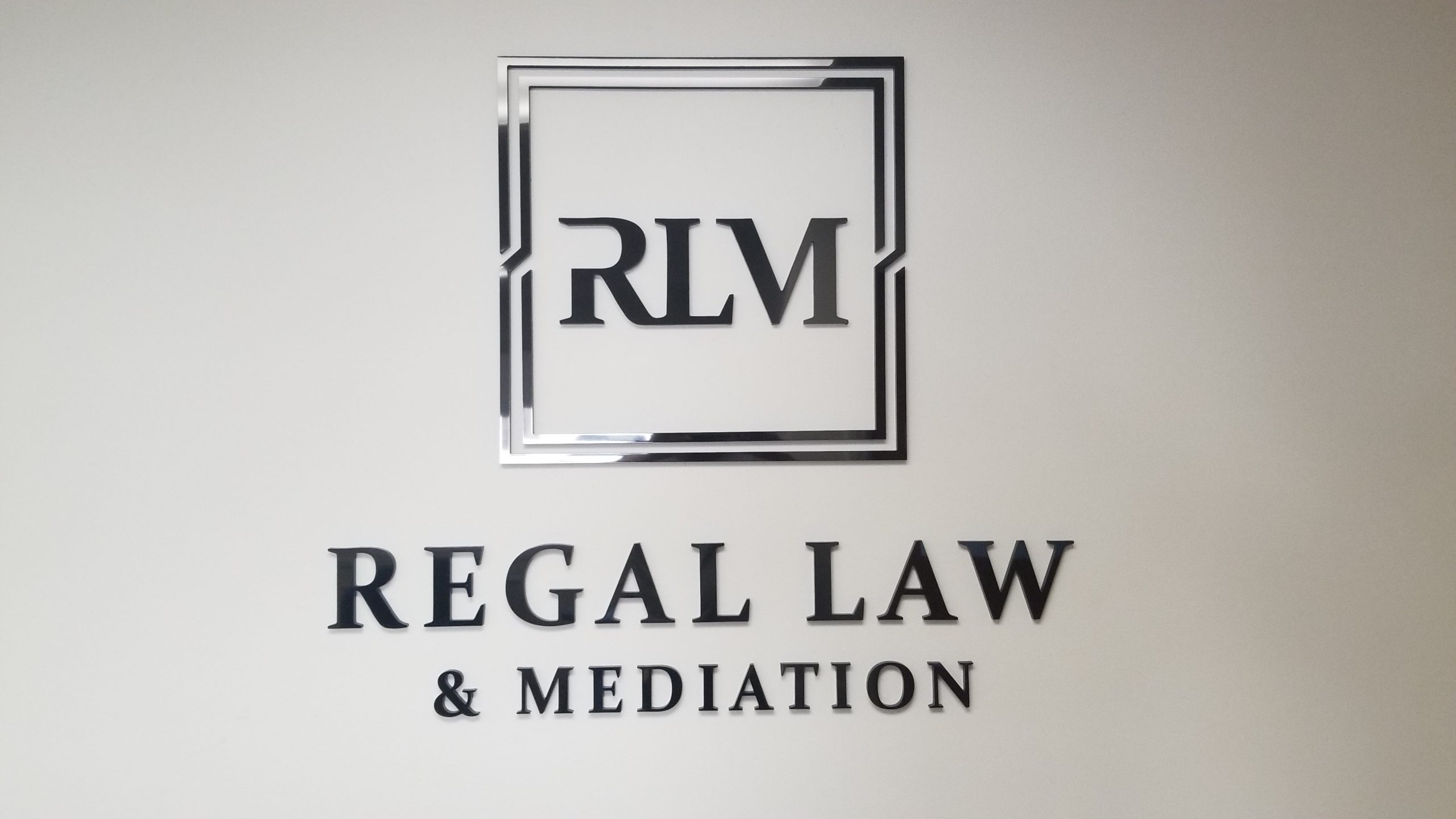 This time the focus is on the laser-cut acrylic office lobby sign for Regal Law. Now the Torrance legal firm has a stunning centerpiece.