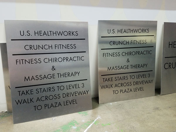 Parking Lot Wayfinding Sign for Crunch Fitness in Oceangate, California Sign Fabrication and Installation for Crunch Fitness Southern California Los Angeles California Gym Sign Package Los Angeles Sign Company Premium Sign Solutions Southern California Sign Makers