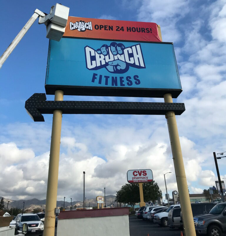 Pole Sign / Pylon Sign Insert and Banner Sign Fabrication Installation for Crunch Fitness in Northridge, California Los Angeles California Gym Sign Package Los Angeles Sign Company Premium Sign Solutions Southern California Sign Makers