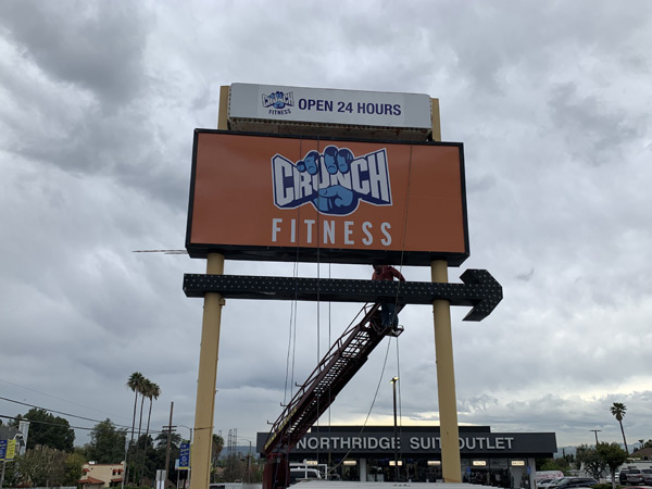 Completed Pylon Insert Installation for Crunch Fitness in Northridge, California Sign Fabrication Installation Los Angeles California Gym Sign Package Los Angeles Sign Company Premium Sign Solutions Southern California Sign Makers