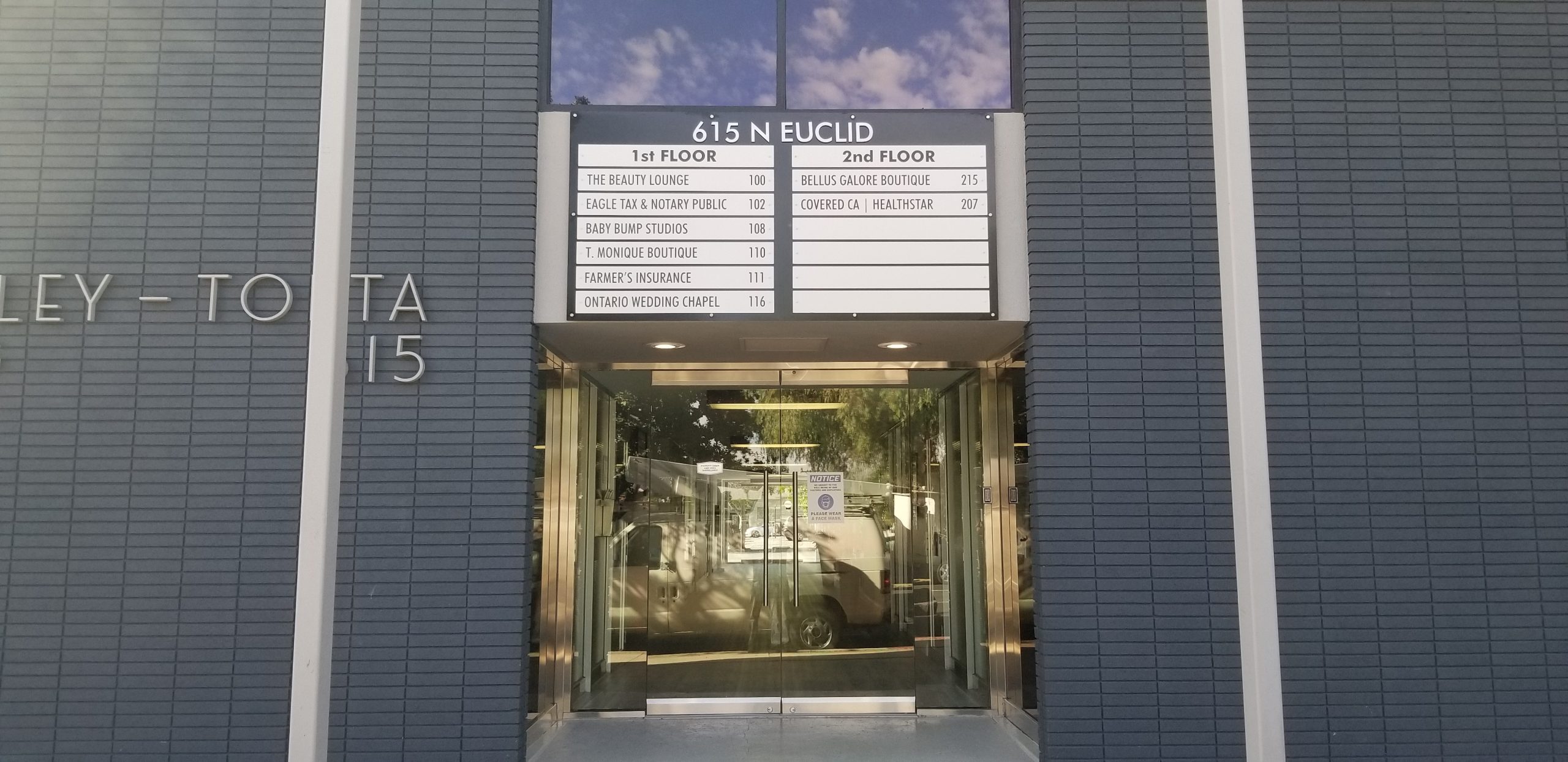 For  615 Euclid in Ontario we fabricated and installed this multitenant directory building sign with changeable tenant inserts.