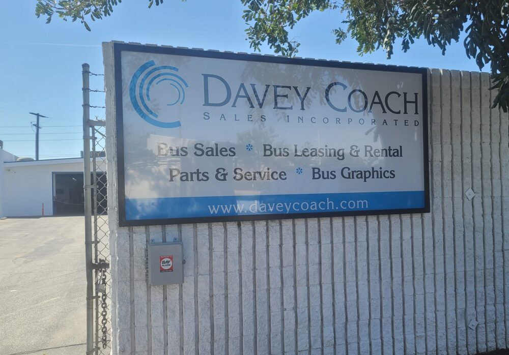 Window Graphics and Custom Metal Business Sign Package for Davey Coach in Norwalk