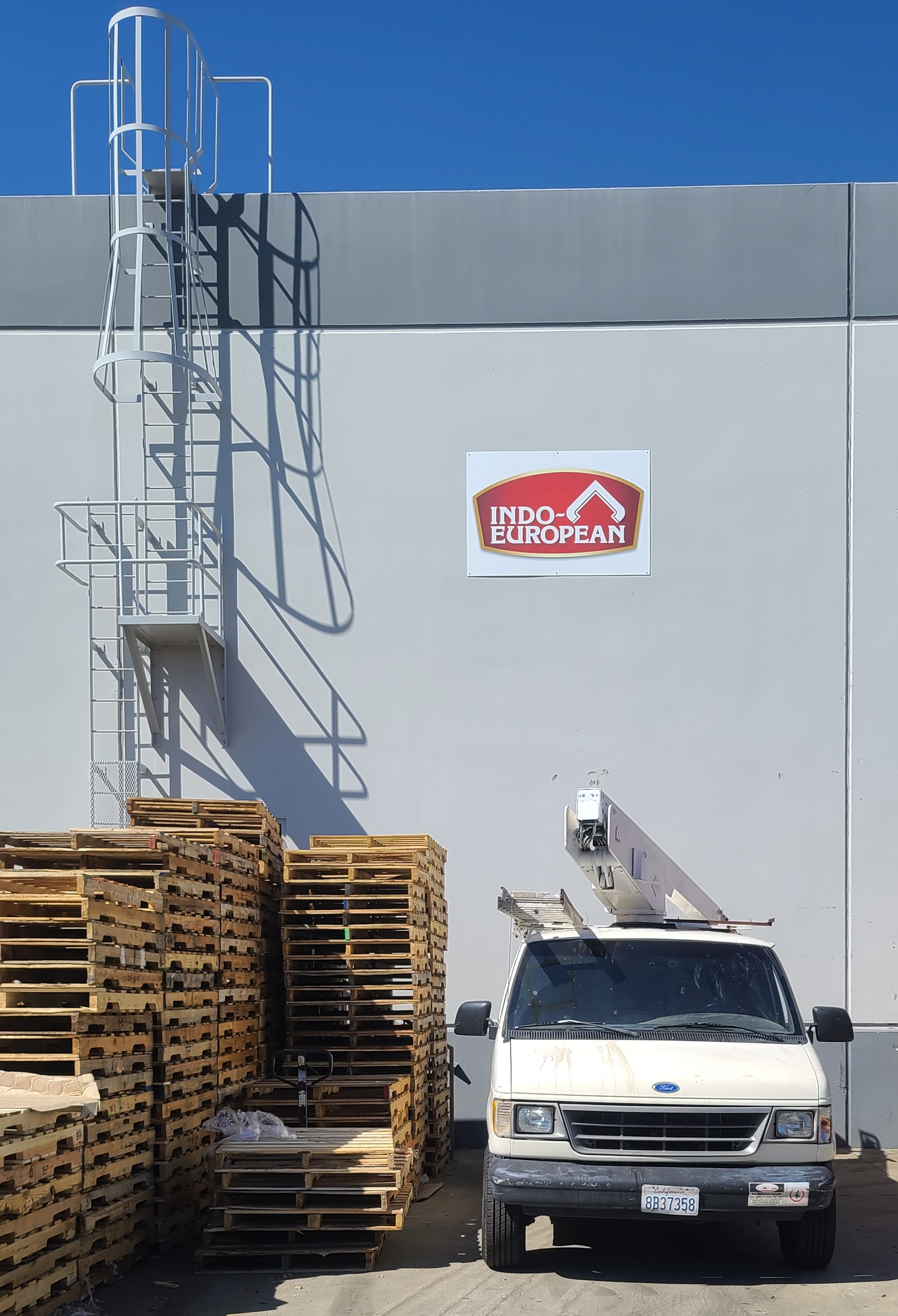 Our custom metal business sign package for Indo-European's Commerce facility loading bay.