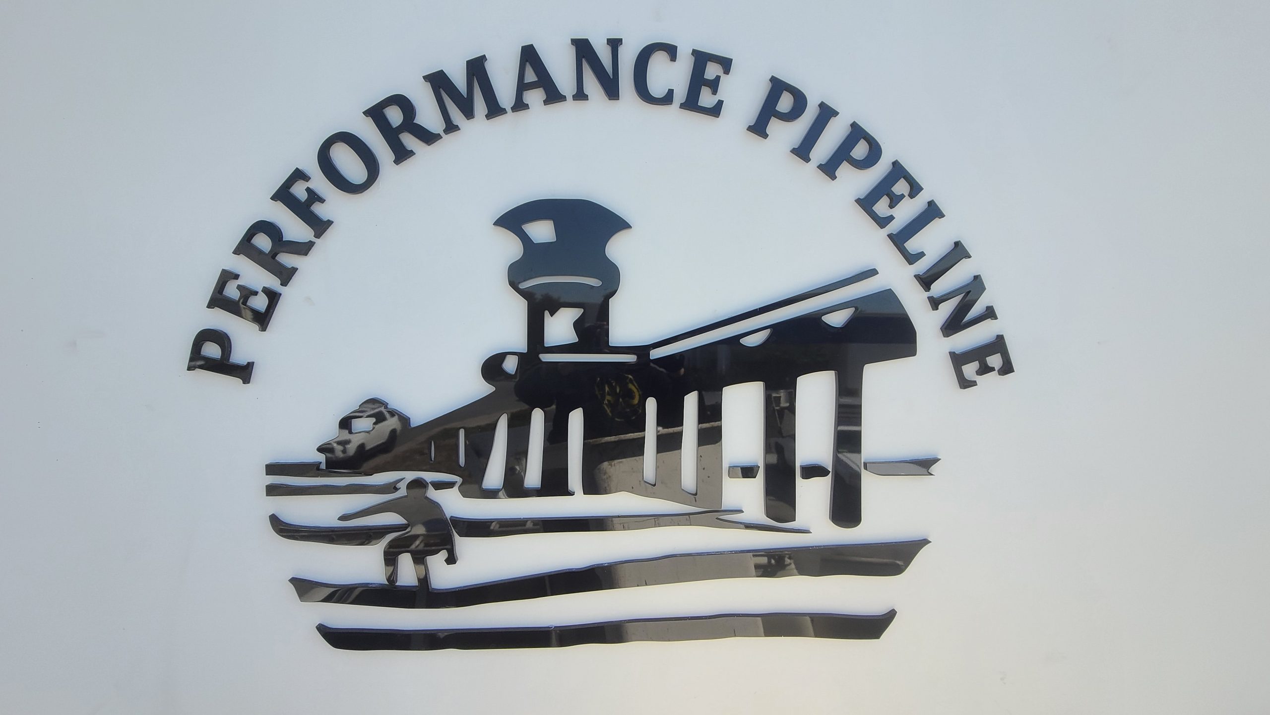 A closer look of the company logo and address numbers signs we made for Performance Pipeline in Huntington.