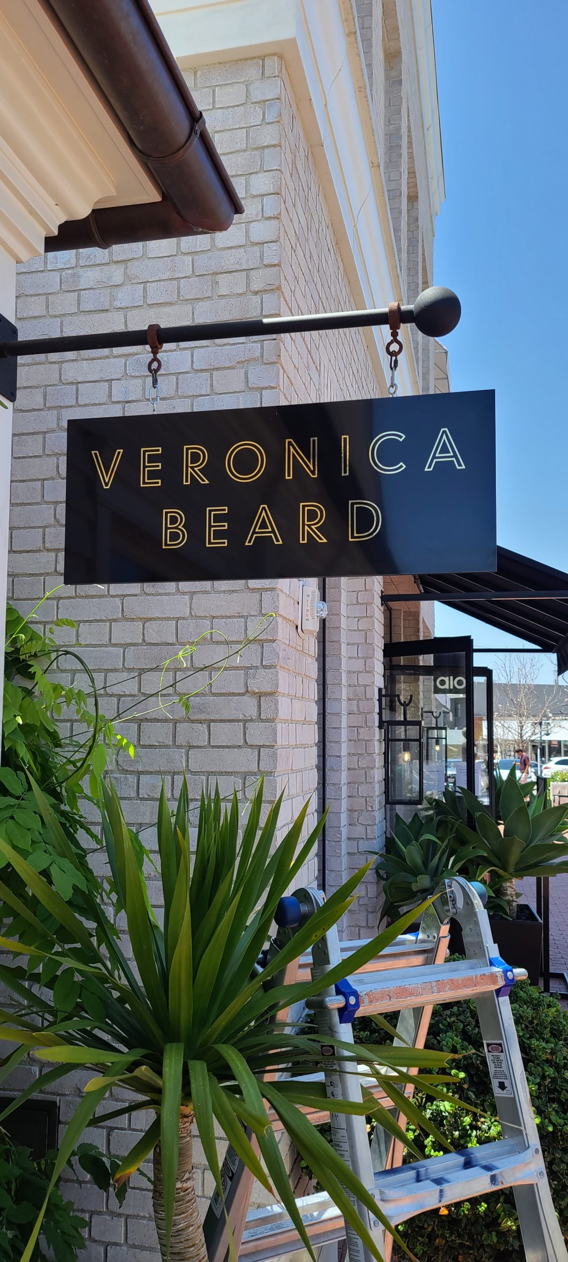 With more shoppers going out and about, captivating signage is a must. Like these blade signs for Veronica Beard in Pacific Palisades.