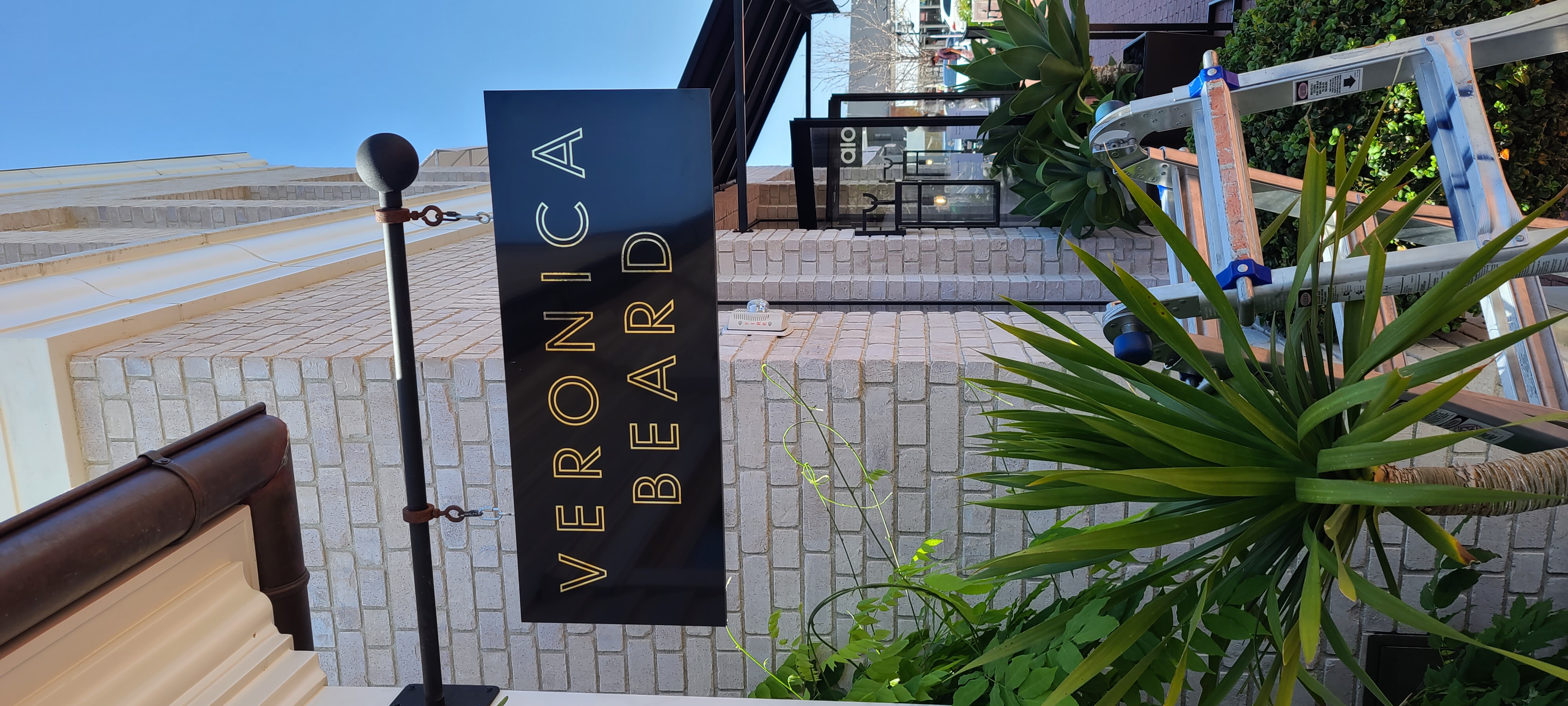 With more shoppers going out and about, captivating signage is a must. Like these blade signs for Veronica Beard in Pacific Palisades.