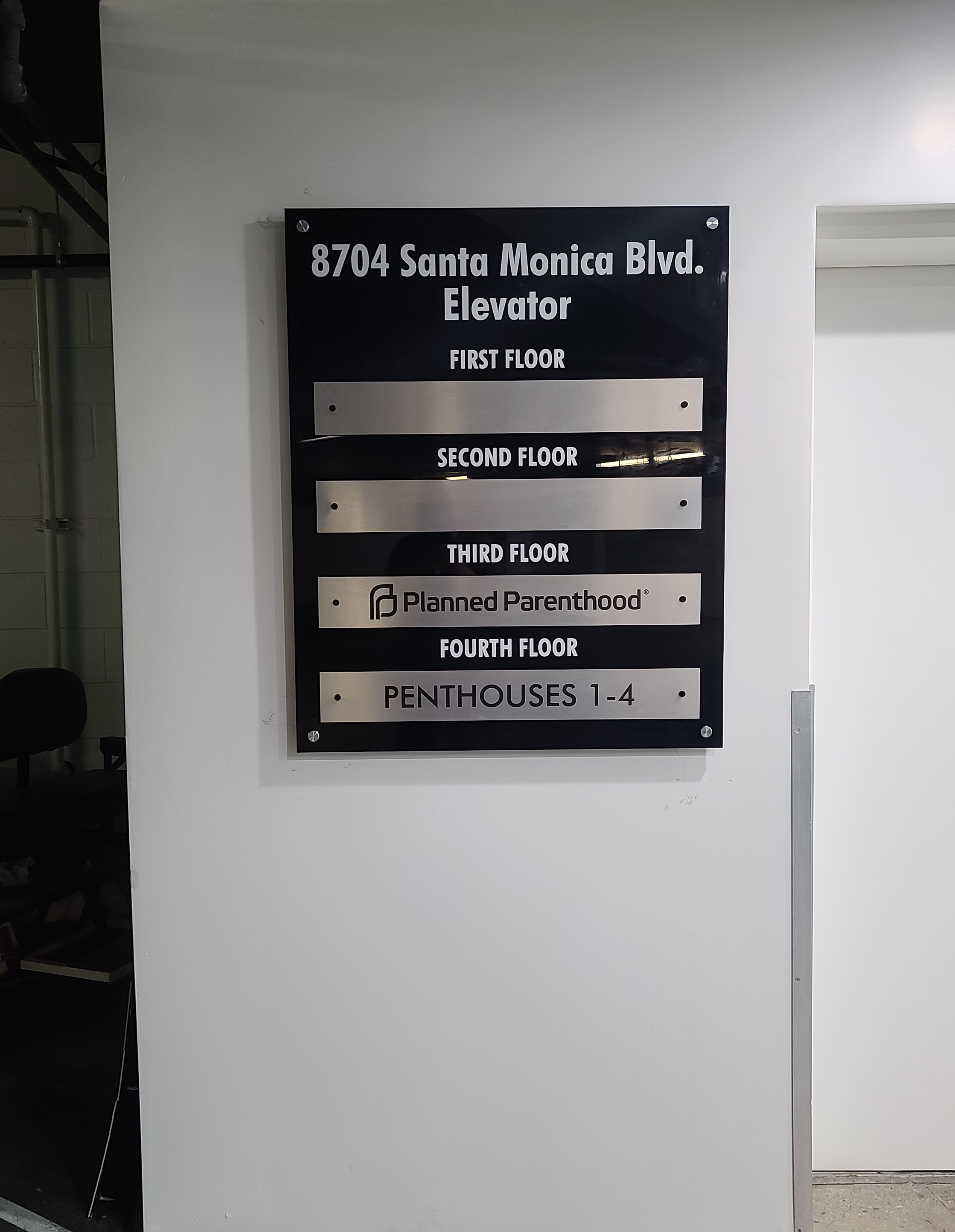 More from our sign package for Ronco Investments Inc. We fabricated and installed these basement directory signs in their Beverly Hills building.