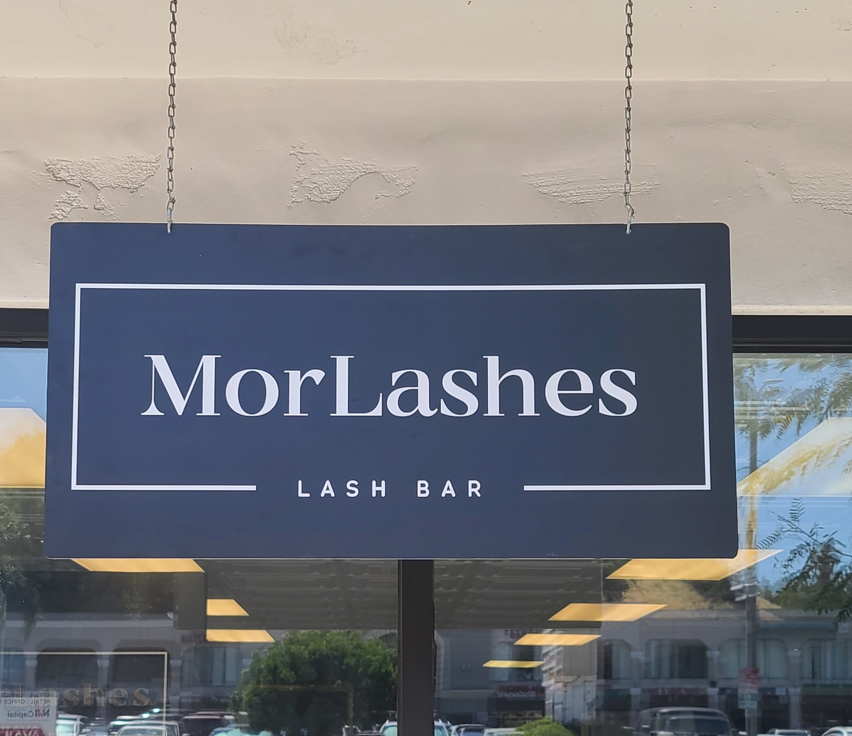 This hanging metal salon sign gives Mor Lashes' Tarzana branch extra brand visibility. This compliments the storefront signage we previously installed for them.
