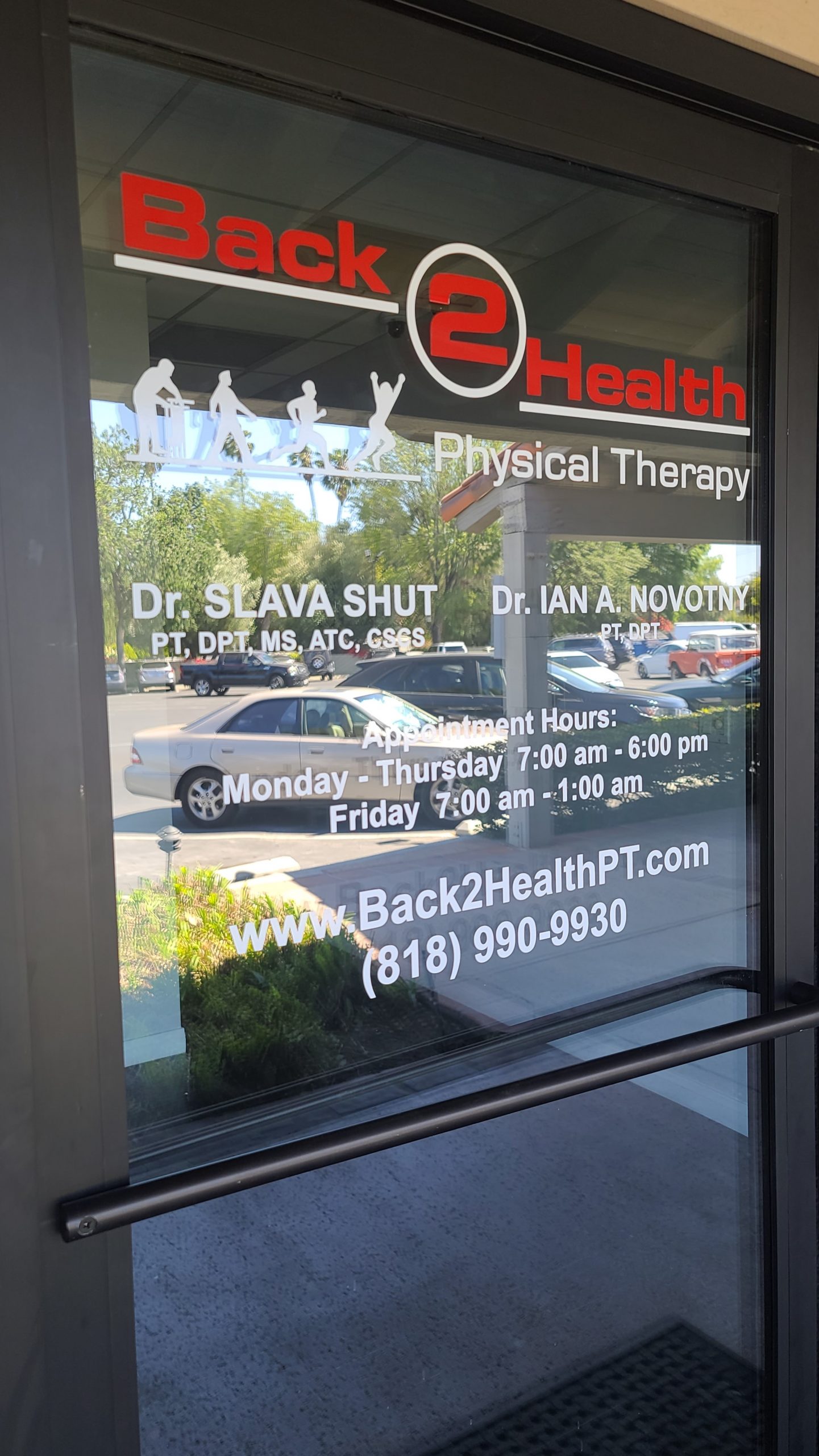 Doorway window graphics for Back 2 Health's sign package for their Encino physical therapy center.
