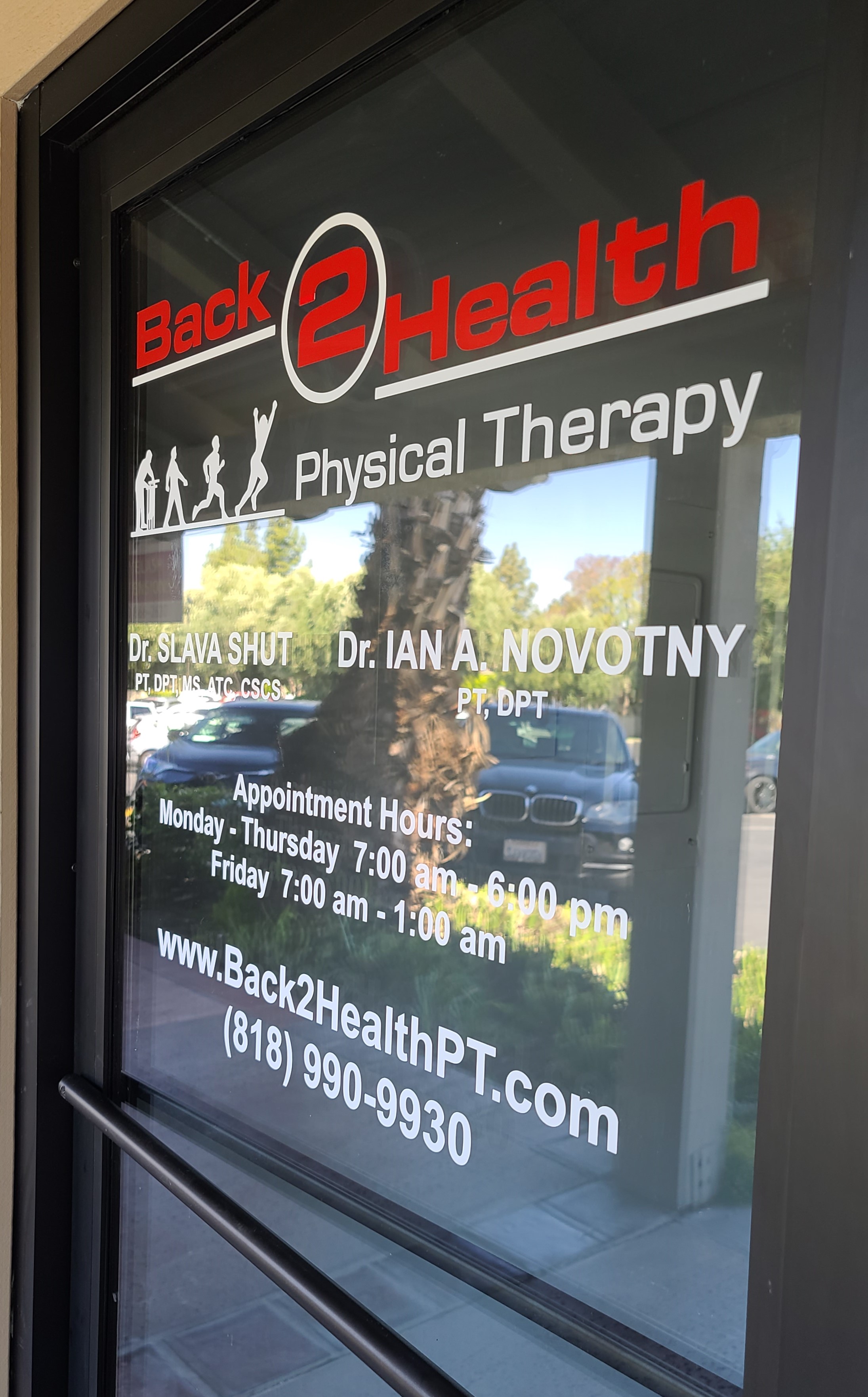 Doorway window graphics for Back 2 Health's sign package for their Encino physical therapy center.