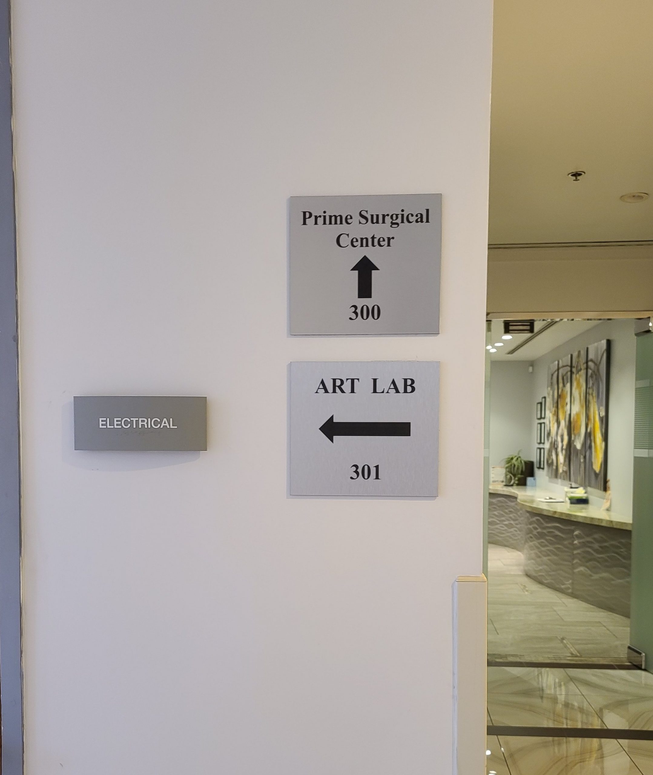 These hospital plaque signs for West Valley Medical Center serve as hallway wayfinding signs making the Encino hospital easier to navigate.