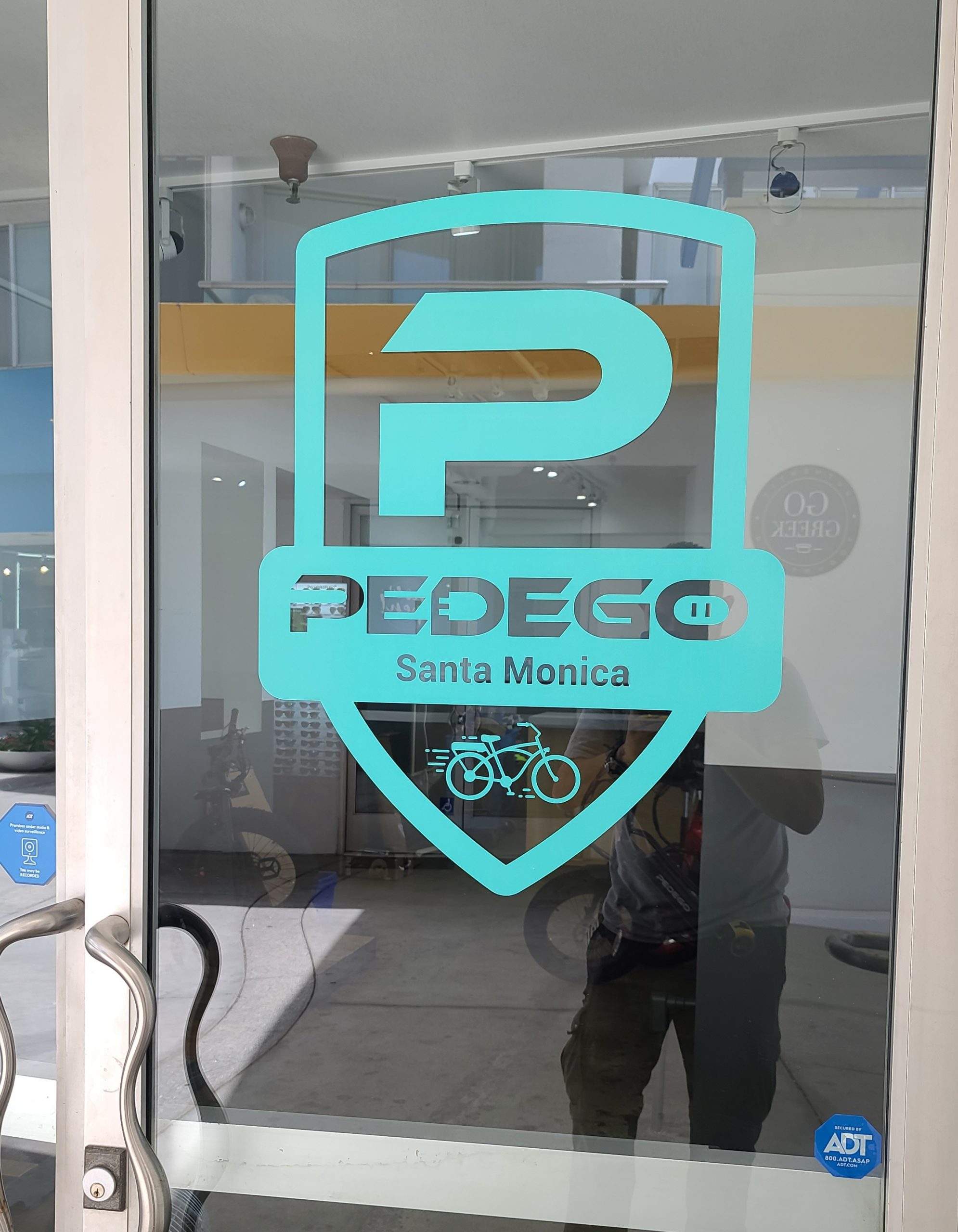 These door signs are part of our window graphics sign package for Pedego's Santa Monica branch and compliment the storefront signs for the electric bike seller.