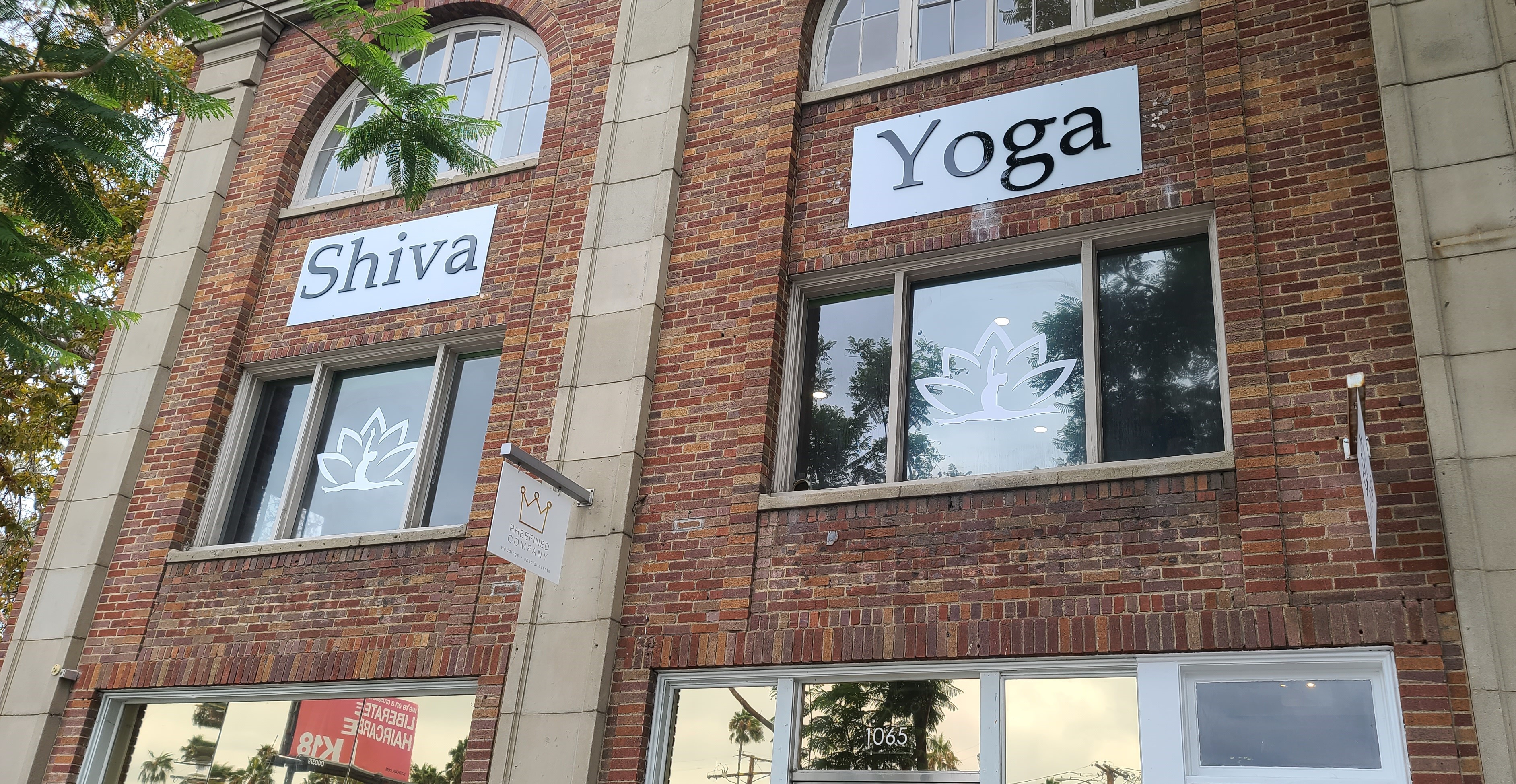 This is the studio sign for Shiva Yoga's West Hollywood establishment, composed of acrylic letters on a metal panel over their entrance.