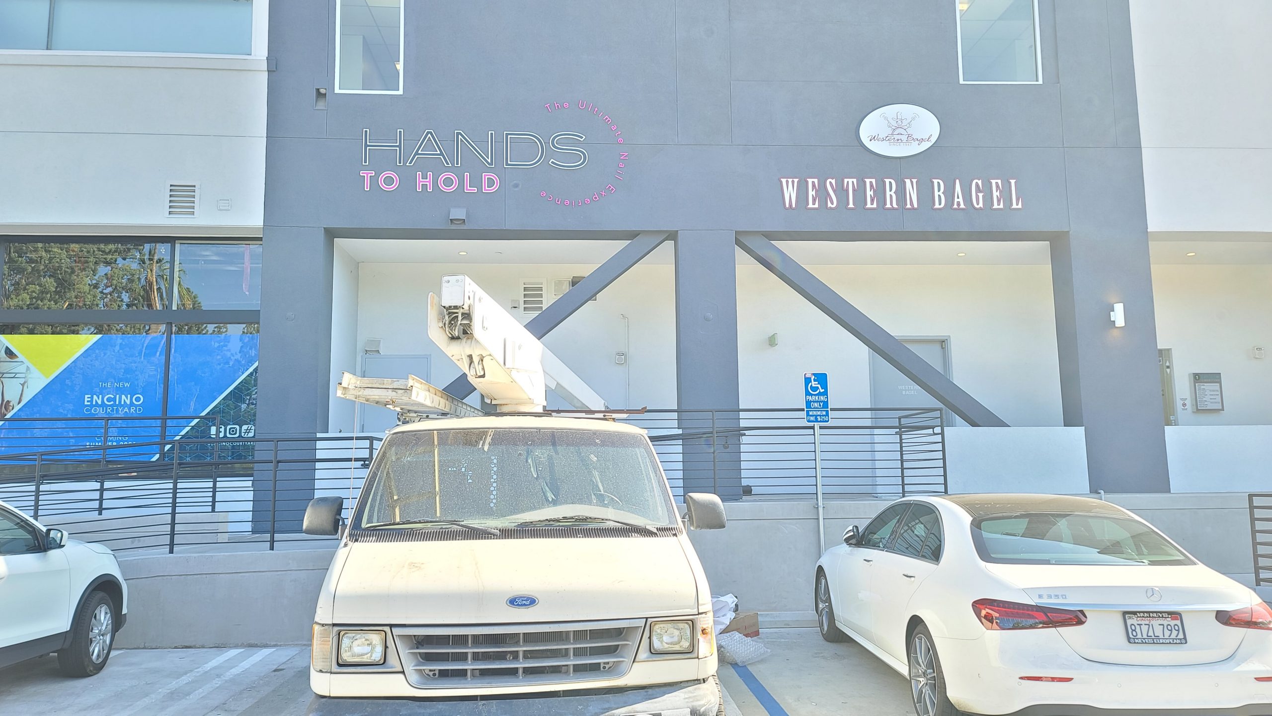 This is the salon sign for Hands to Hold's establishment in Encino Courtyard, it shows potential customers the caliber of the brand's styling services.