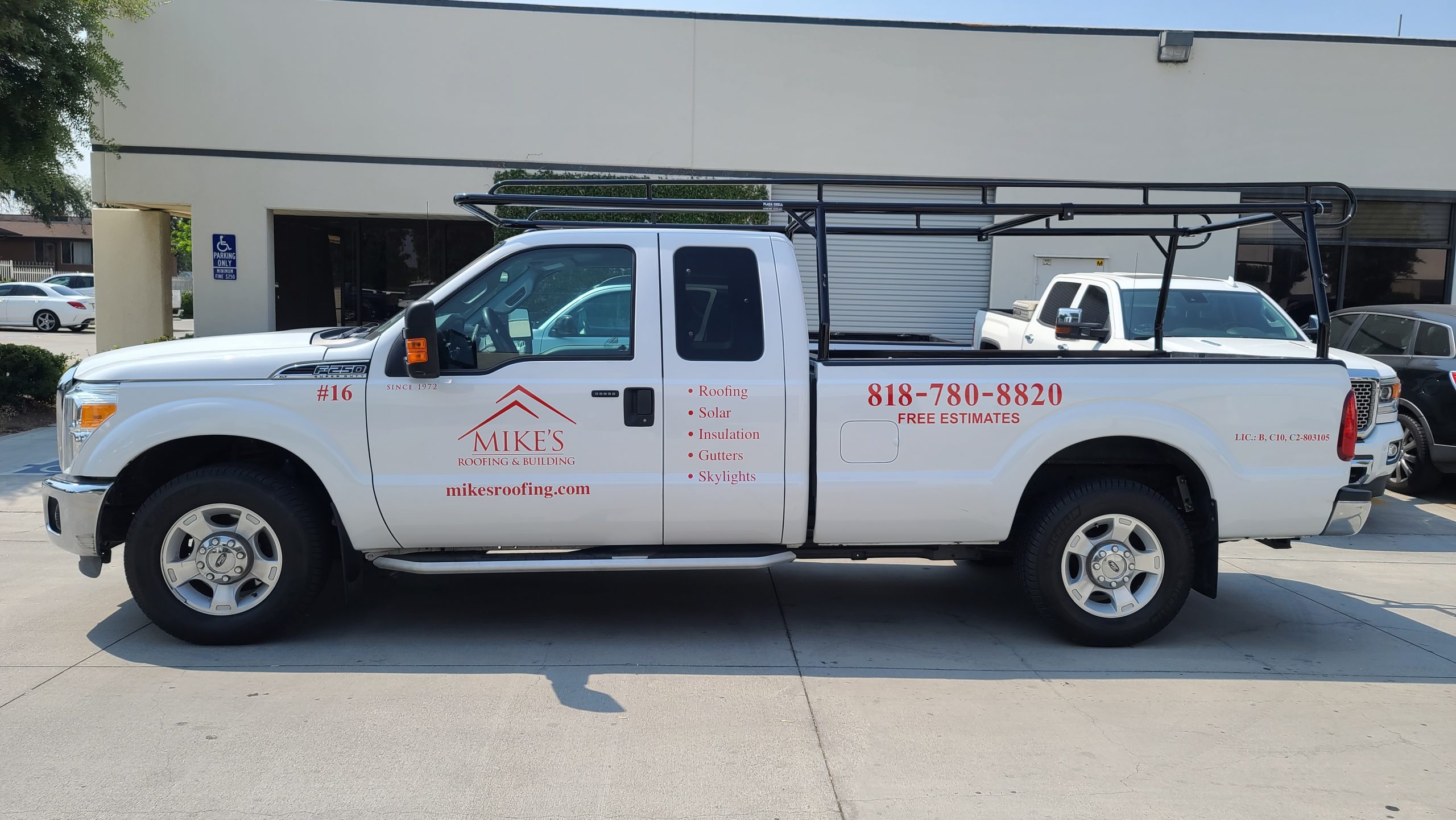 Rebranding also applies to vehicle wraps and graphics, like these new car decals for Mike Roofing's service truck that feature their company logo and contact details.