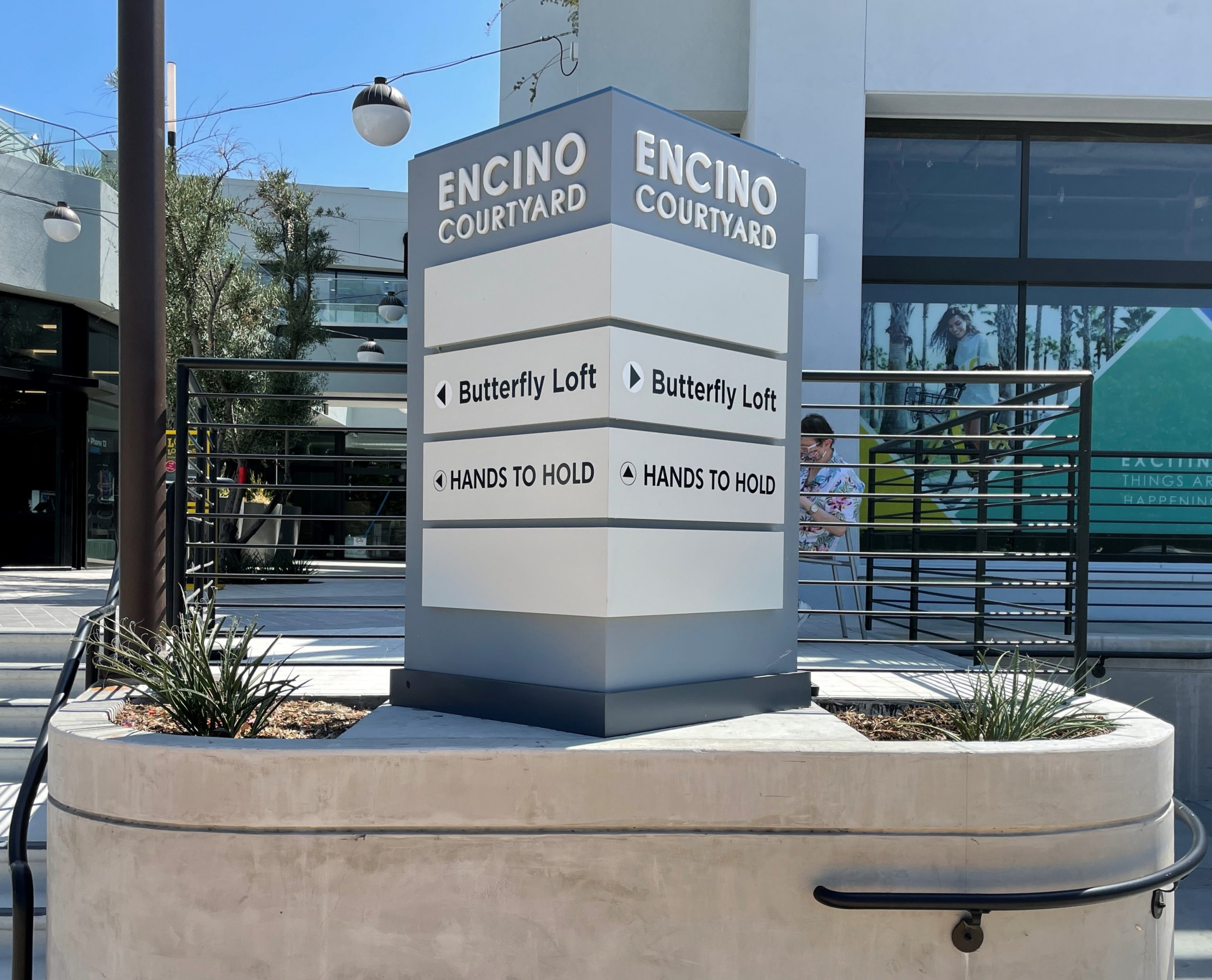 Businesses in commercial spaces can use outdoor wayfinding signs to guide customers. Like these signs for Hands to Hold's Encino Courtyard branch.