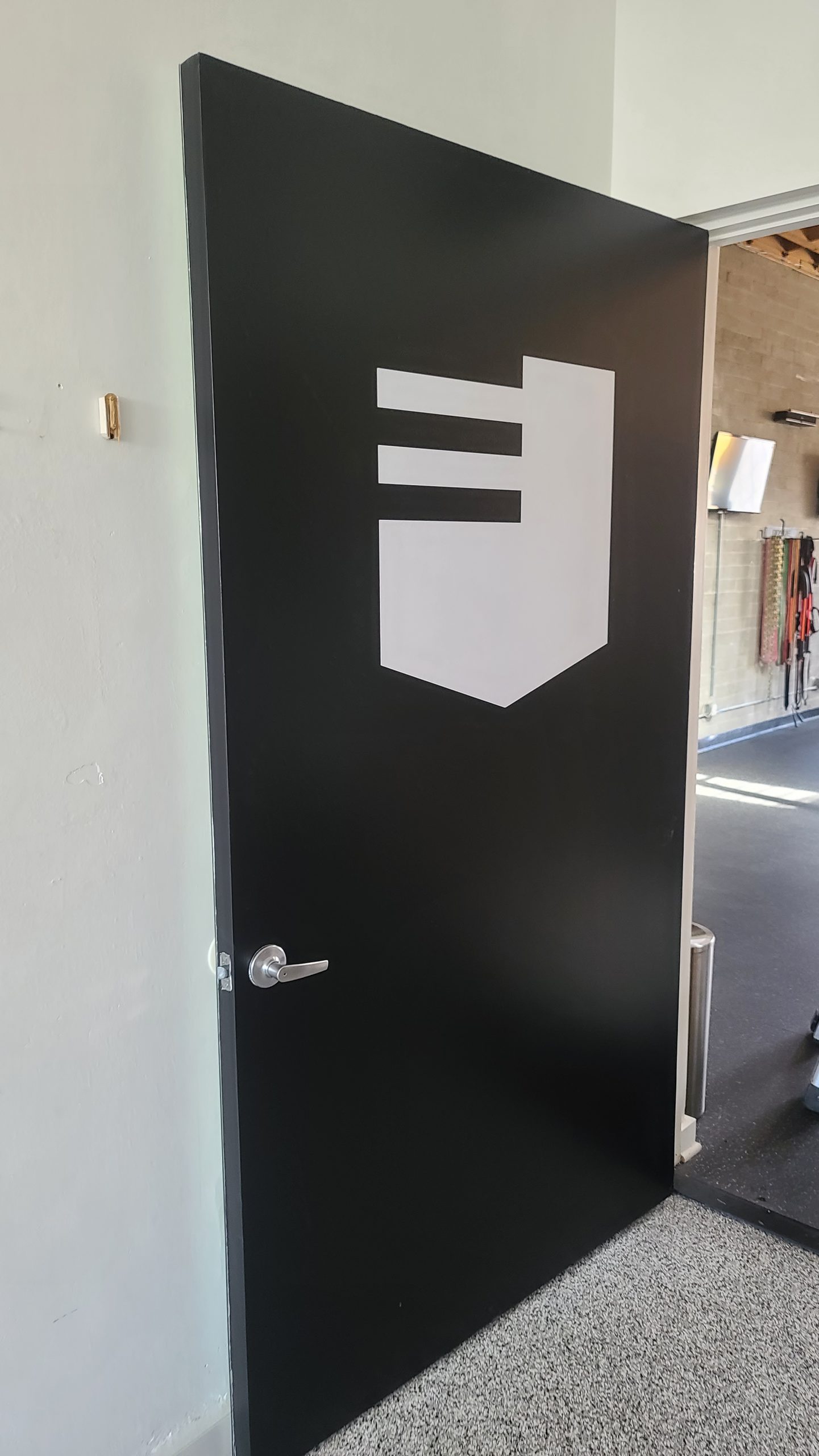 Door graphics for Esser's gym, giving them a memorable entrance sign, so their brand will be prominent for customers going in their Culver City branch.