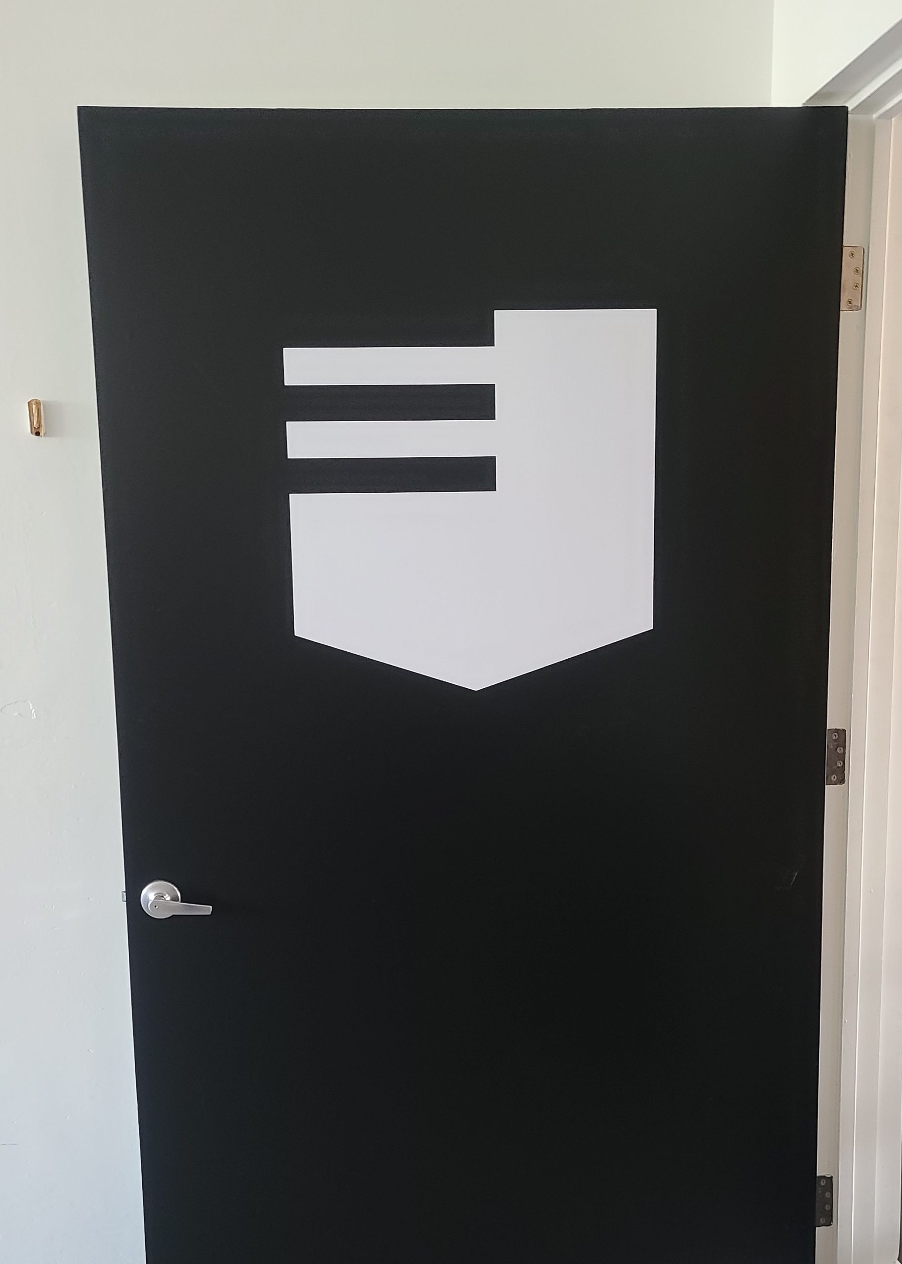 Door graphics for Esser's gym, giving them a memorable entrance sign, so their brand will be prominent for customers going in their Culver City branch.