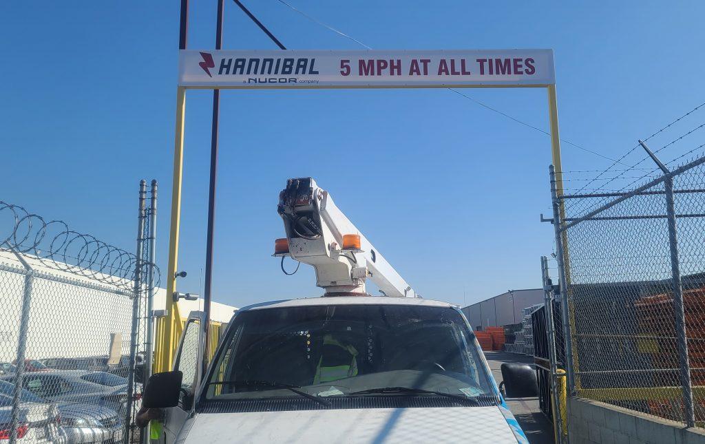 This is the gate sign we installed for Hannibal Nucor. It is a banner for their Vernon facility showing the speed limit to ensure the safety of the workplace.