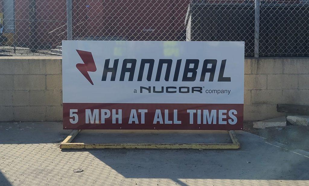 These dibond signs for Hannibal Nucor's Vernon location make their branding visible while serving as entrance signs and directional signs.