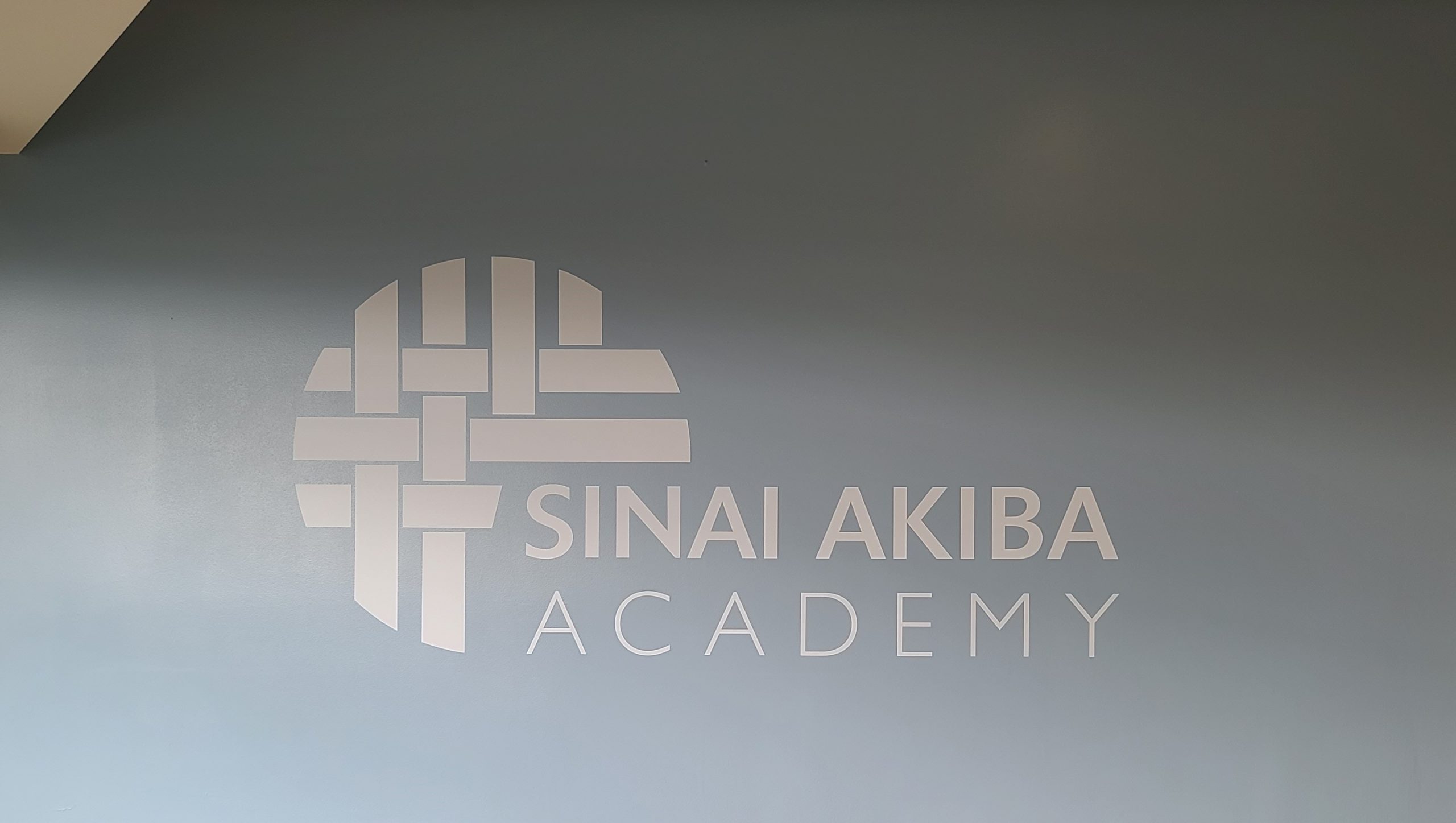 Schools display their brand to foster a sense of community and identity like the school wall graphics we installed for Sinai Akiba Academy in Los Angeles.