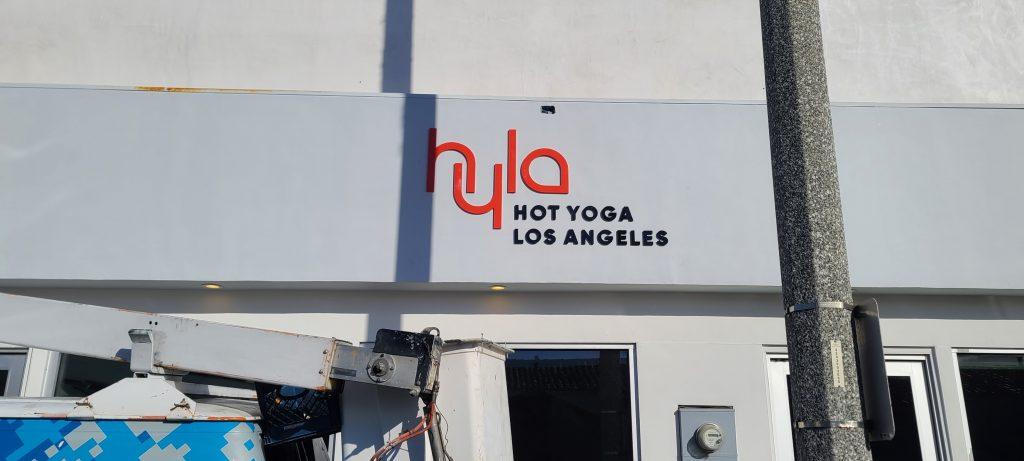 The acrylic letters building sign we fabricated and installed for Hot Yoga Los Angeles' studio in Manhattan Beach. Los Angeles sign company serving San Fernando Valley, Tarzana, Pomona and all of Southern California. Premium Sign Solutions Specializing in Storefront Signs, Lobby Signs, Indoor Signs and Outdoor Signs for Businesses.