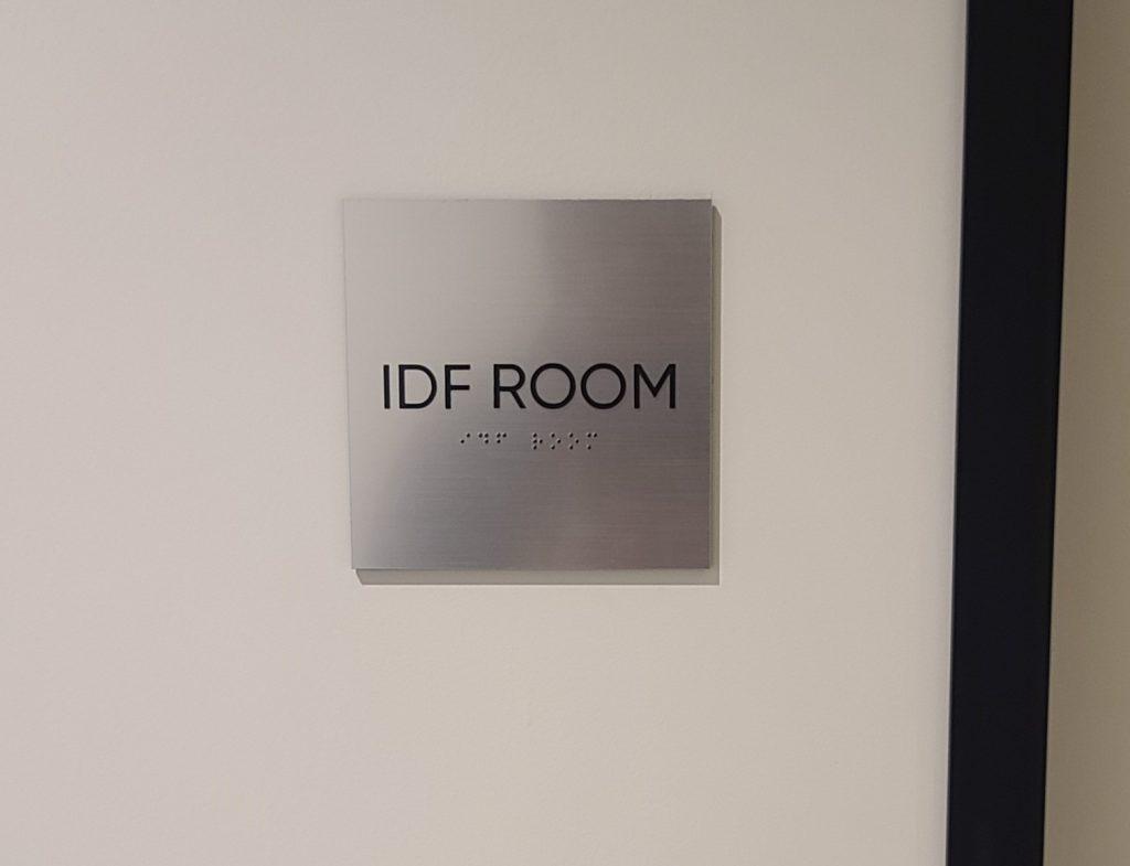 ADA sign with braille. These ADA directional signs with braille for Simple Practice will enhance their Santa Monica office by providing visual and tactile displays outlining various areas such as their IDF and copy rooms.