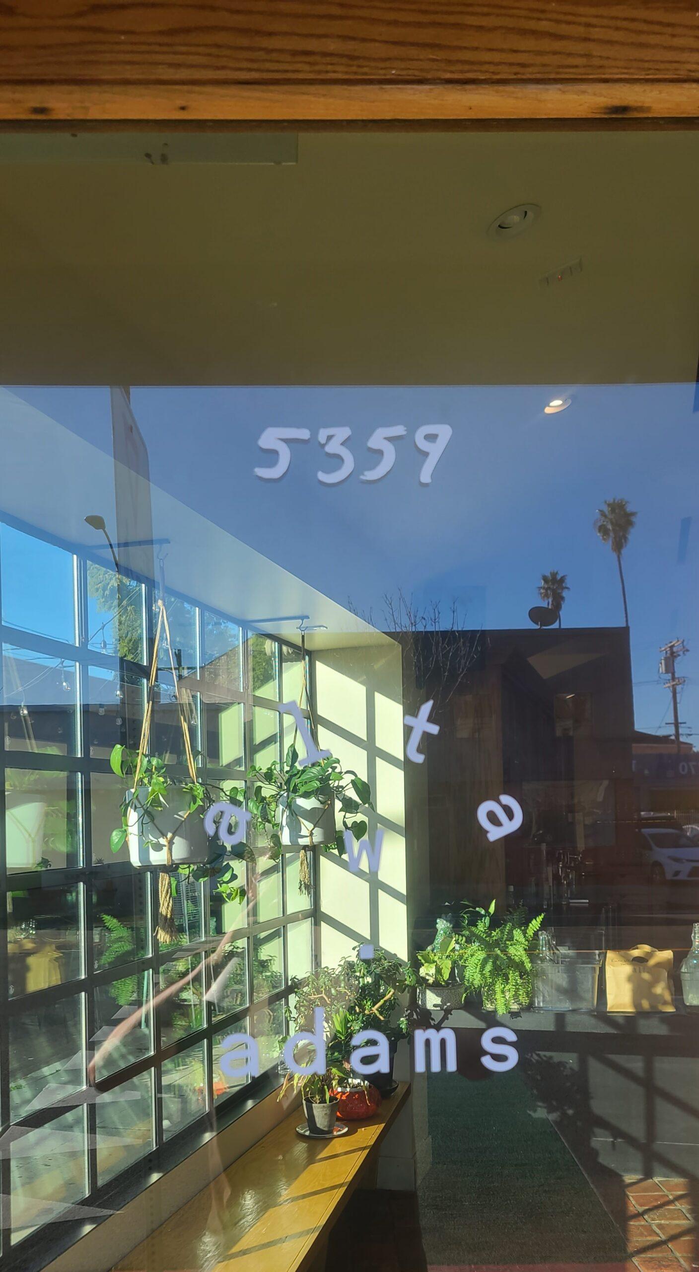 This is the window vinyl sign for Alta Adams in Los Angeles, representing the brand while giving passersby a good glimpse of the people inside enjoying their meals.