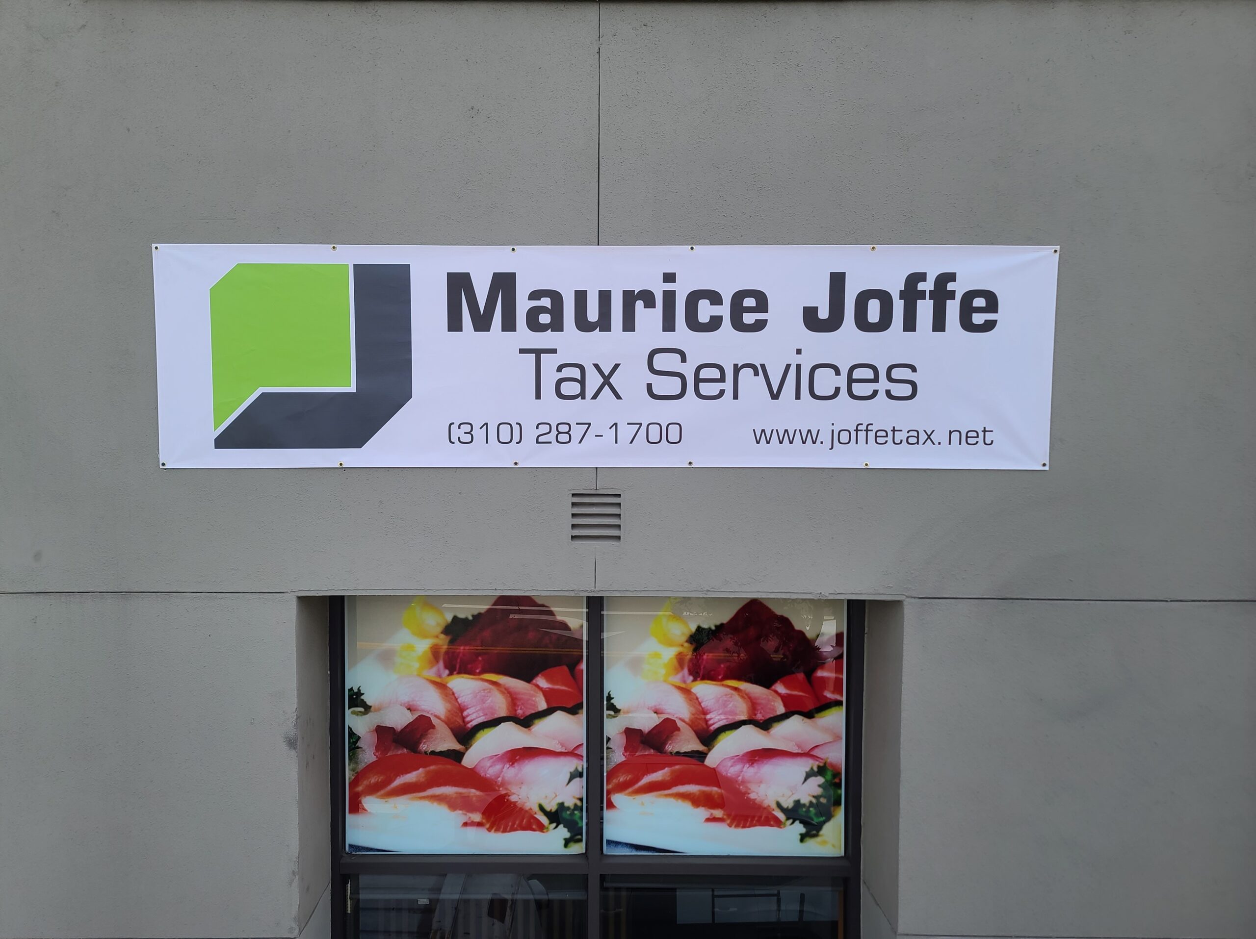 This custom banner for Maurice Joffe Tax Services in Los Angeles displays their company name, brand logo, as well as contact details.