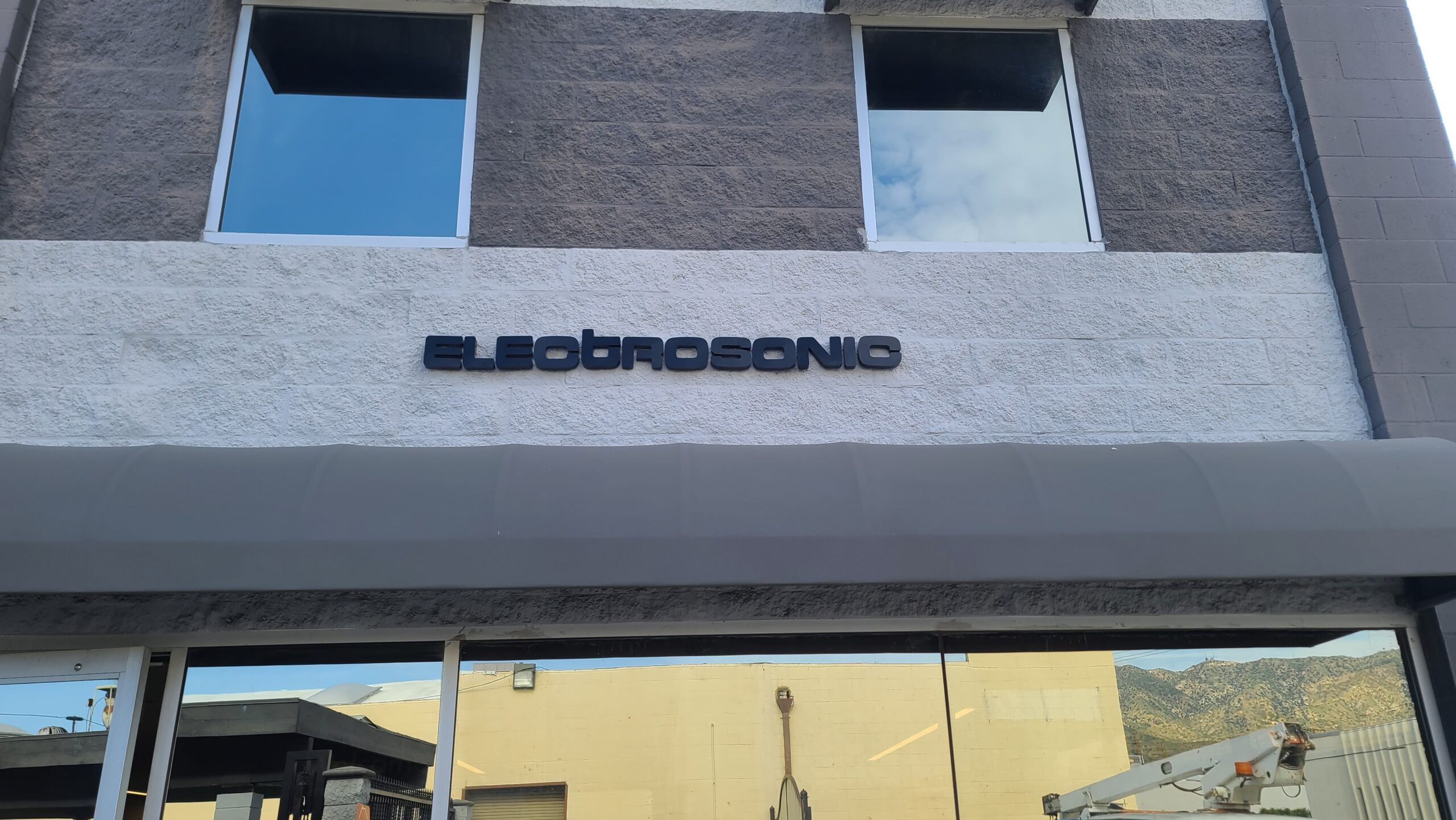 These sleek stainless steel building signs for Electrosonic's Burbank location are imposing sights that will impress clients.