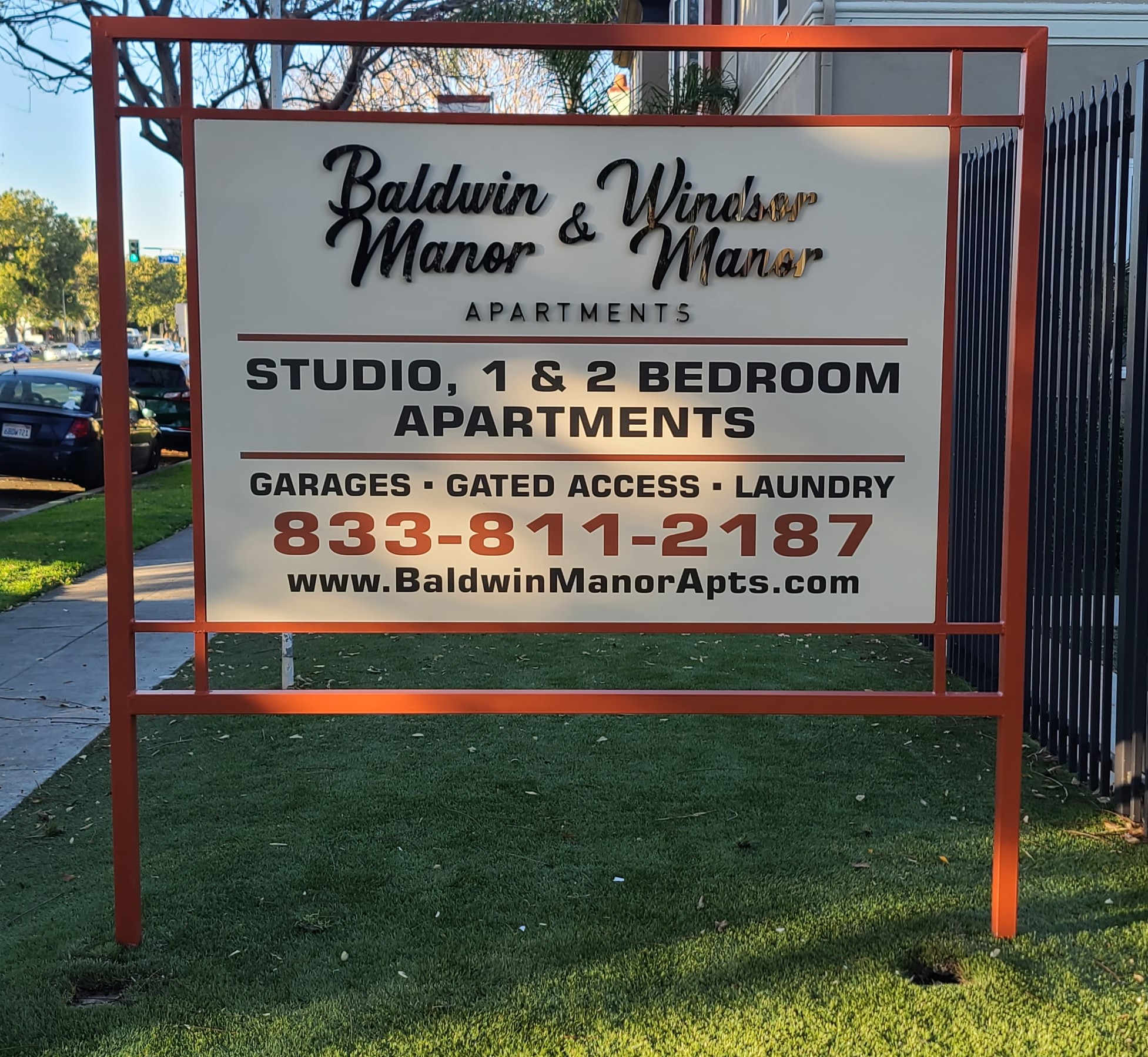 This is the apartment monument sign for Jones and Jones in Los Angeles. It advertises Baldwin Manor and Windsor Manor apartments.