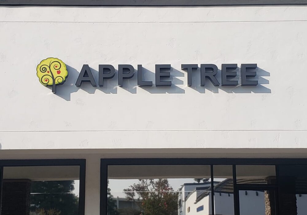 Front lit channel letters light up the Apple Tree