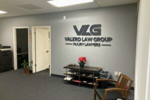 Flat-cut metal Valero Law Group lobby sign
