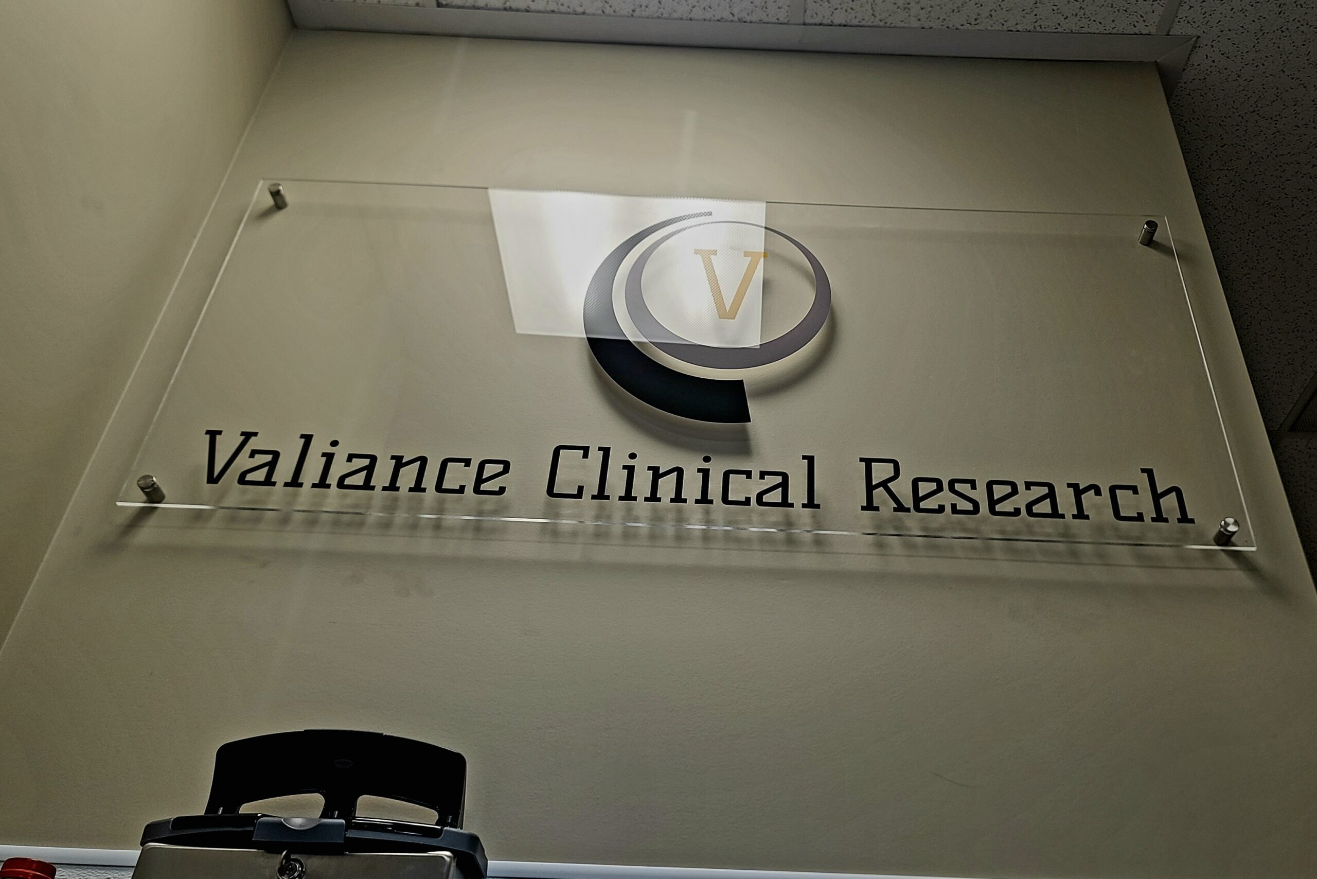 Valiance Clinical Research lobby sign: Sleek, professional, impressive branding at South Gate