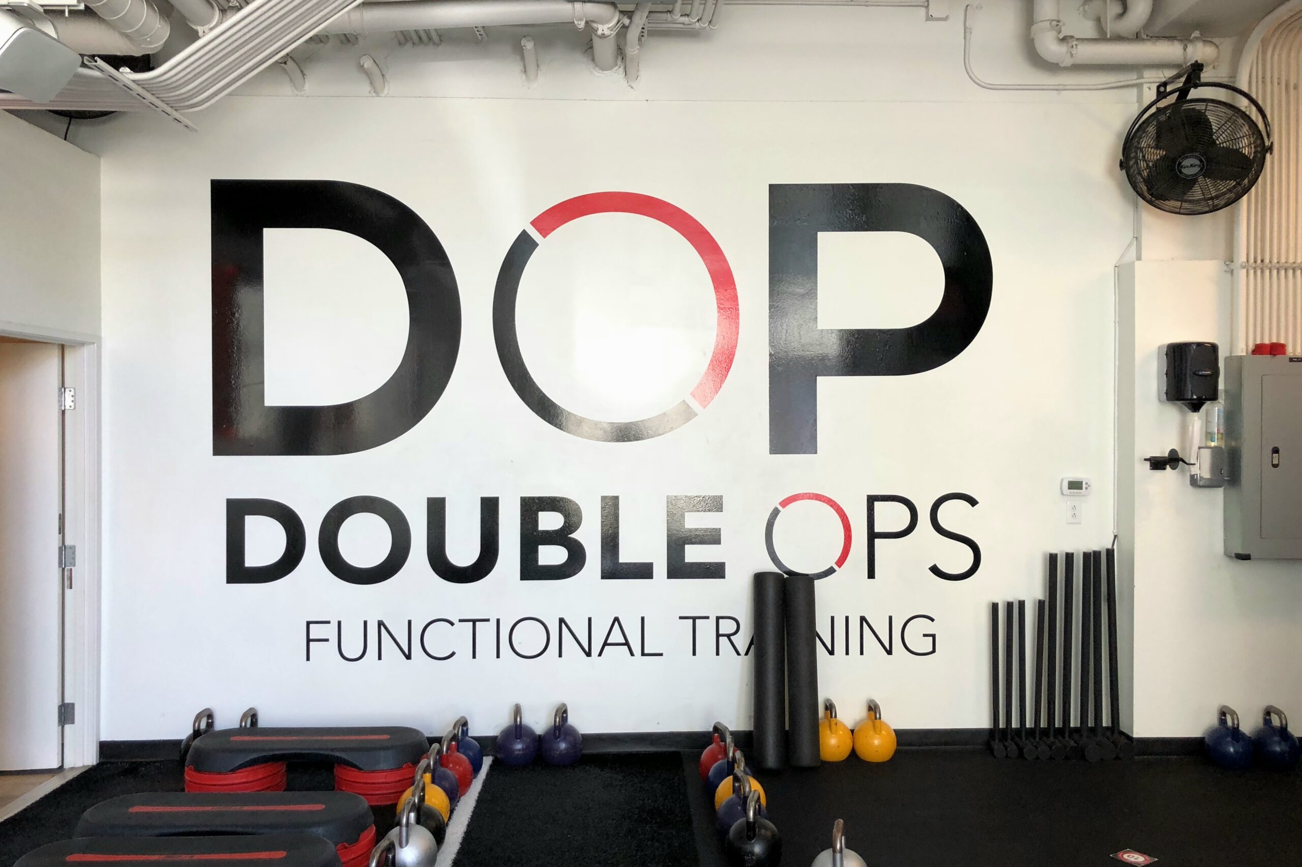 Vinyl lobby sign on wall for Double Ops
