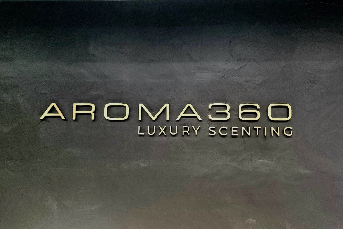 Retail Store Signs - Aroma 360's indoor sign creates an inviting atmosphere for customers.