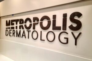 Clinic Sign - An eye-catching lobby sign gracing the entrance of Metropolis Dermatology in Costa Mesa