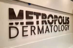 Read more about the article Metropolis Dermatology Lobby Sign Costa Mesa