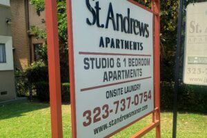 A freestanding apartment building sign with clear details 