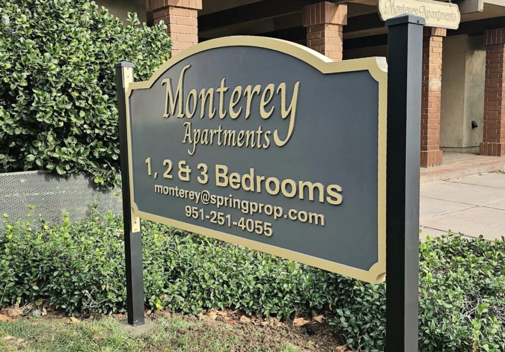 Spring Properties Kensington Apartment sign and Monterey Apartments signs 