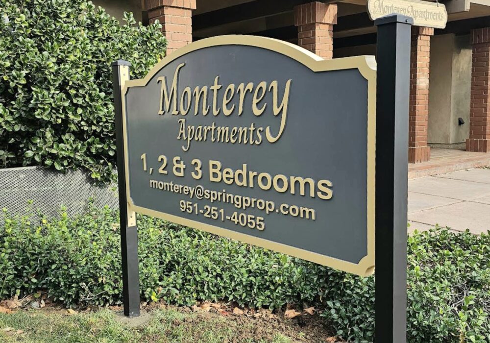 Spring Properties Kensington Apartment sign and Monterey Apartments signs 