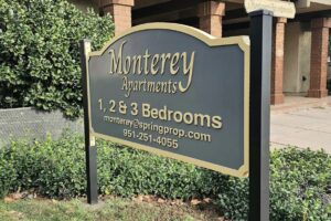 Read more about the article Spring Properties Kensington Apartment sign and Monterey Apartments signs 