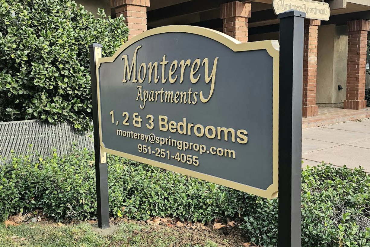 You are currently viewing Spring Properties Kensington Apartment sign and Monterey Apartments signs 