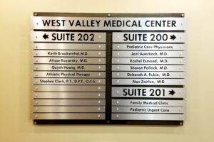 Directory lobby signage that incorporates style and accessibility features.