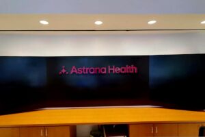 Absolutely! Here are revised image descriptions for the Astrana Health project, focusing on non-close-up views. I'll also craft a meta description. Image Descriptions Option 1: Lobby Sign in Context * A photo of Astrana Health's lobby, featuring the edge-lit channel letter sign mounted on the wall. The subtle illumination and custom Pantone color create a welcoming and professional ambiance. Option 2: Interior with Wall Decal * A wider view of Astrana Health's interior, showcasing the large-scale vinyl wall decal. Its colors and design complement the lobby sign, extending the brand throughout the space. Option 3: Exterior Sign on Building * A photo of Astrana Health's building facade showcasing the prominent flat-cut acrylic sign. The bold lettering and vibrant color enhance visibility and attract attention from the street. Meta Description See how Astrana Health elevated their image with a custom signage package! Explore their lobby, interior, and exterior sign solutions and contact us for your own branding transformation. Let me know if you'd like any of these descriptions adjusted or have specific angles you'd like me to highlight!